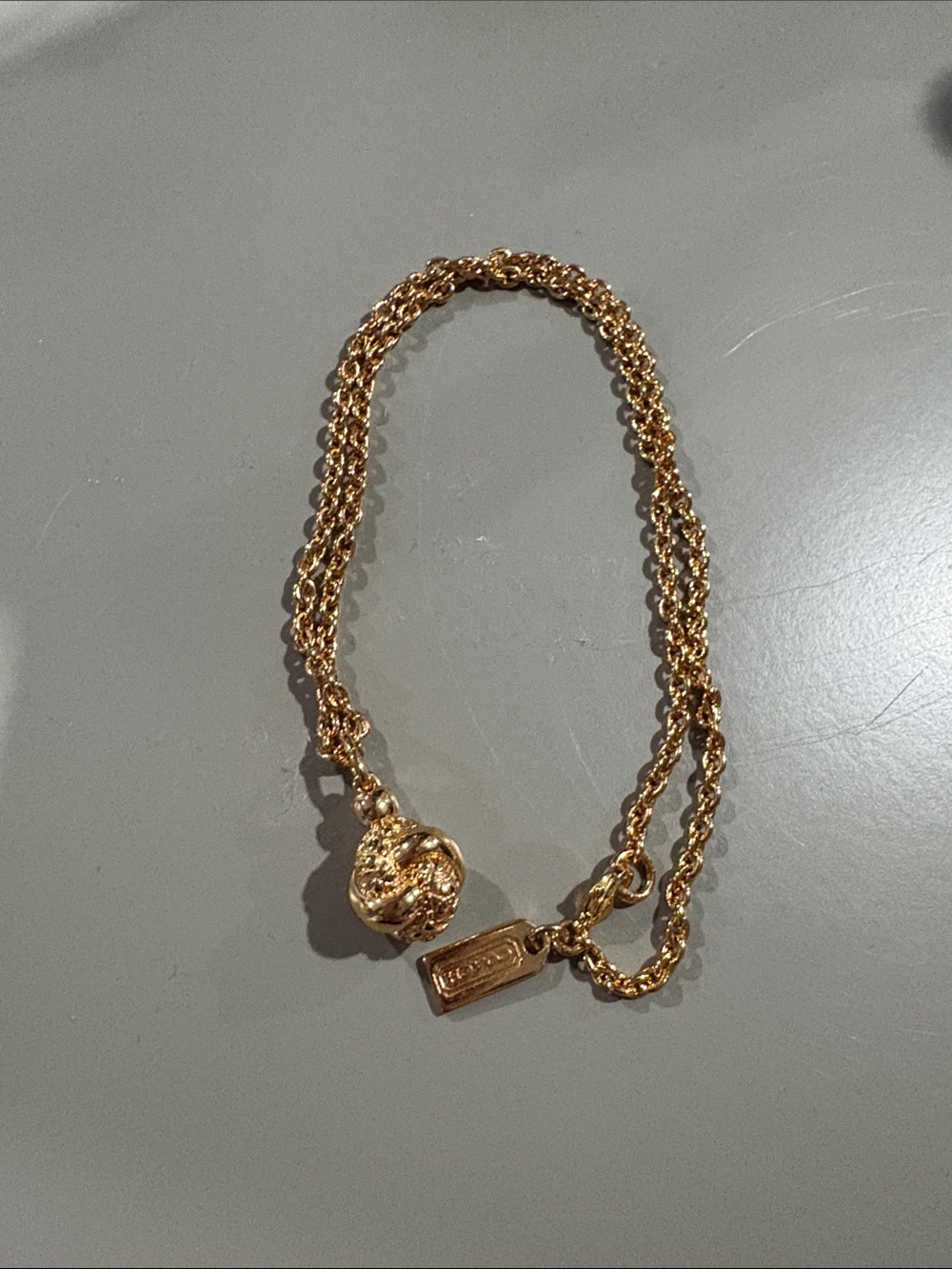 NWOT COACH Gold-Tone necklace with ball pendant